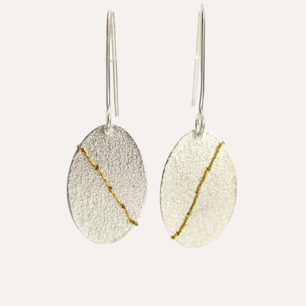 Sewn up earrings large - gold thread