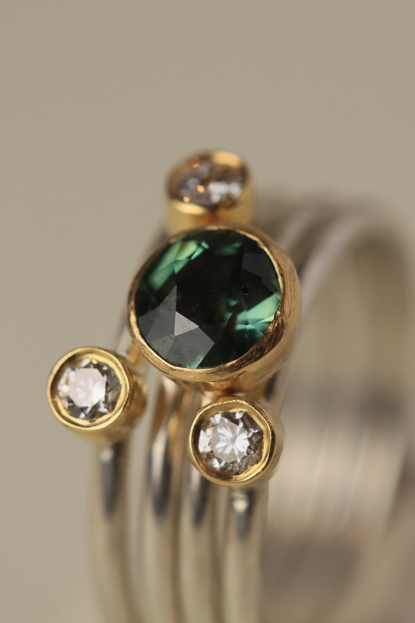 Stacking rings with diamonds and Teal Sapphire