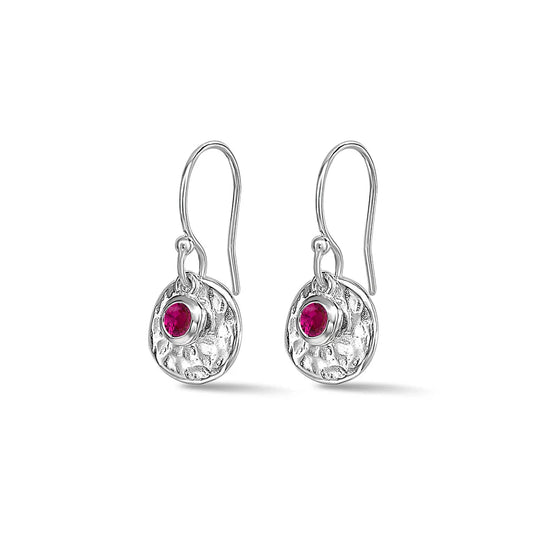 Silver earrings with ruby on a white background
