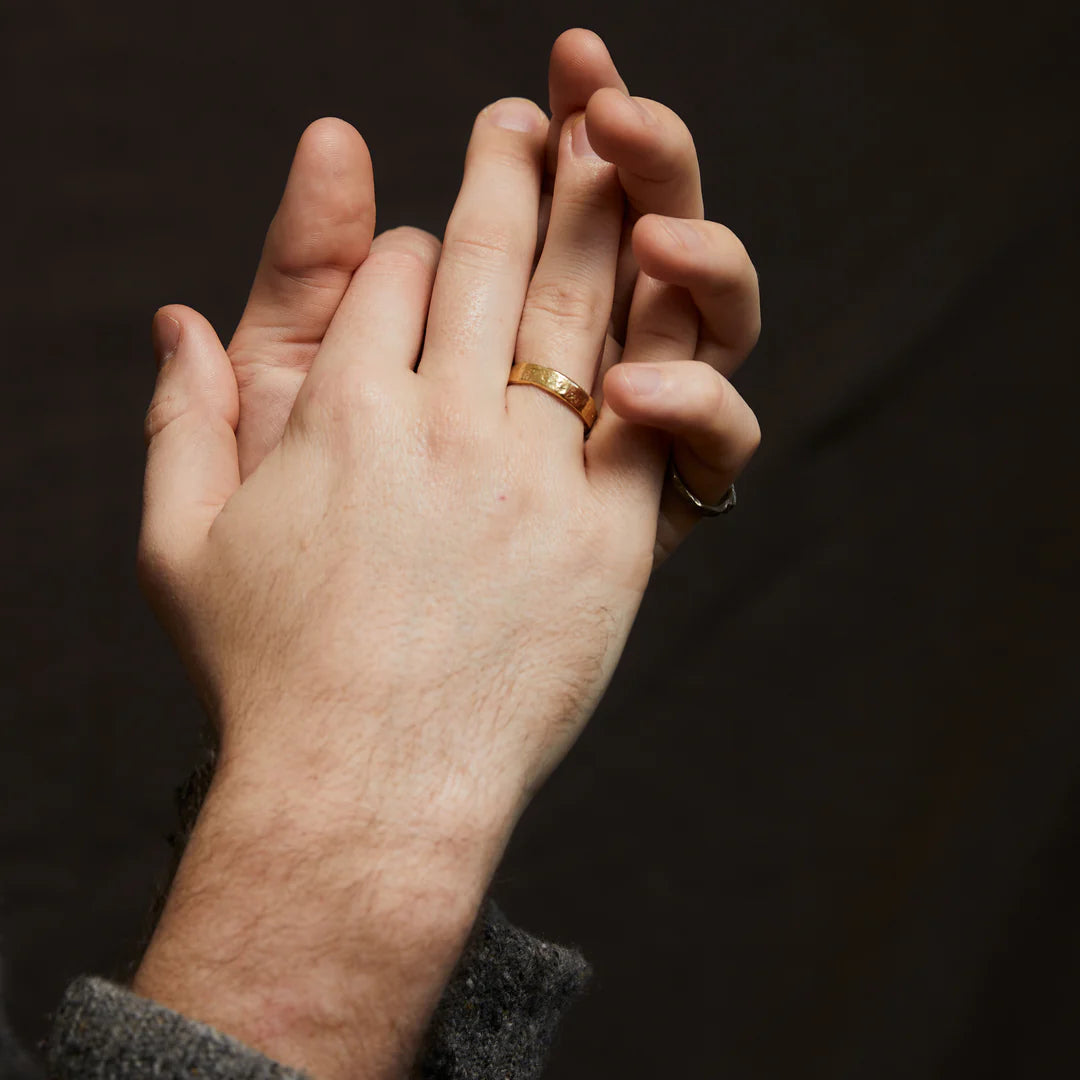 mens gold wedding ring modelled