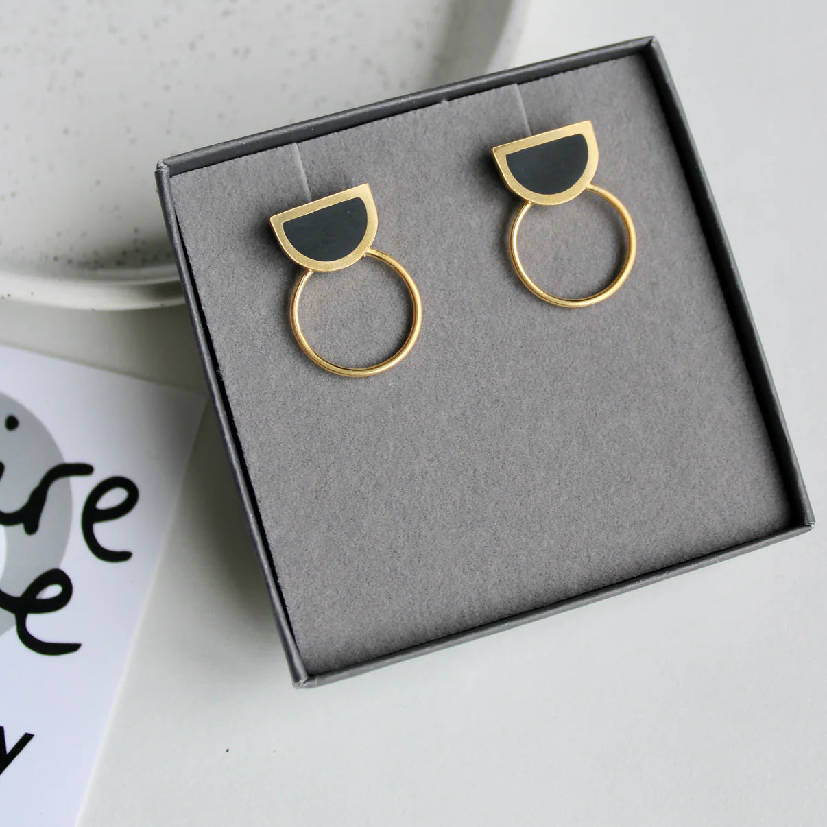 black and gold arc studs