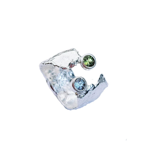Silver, blue topaz and peridot ring