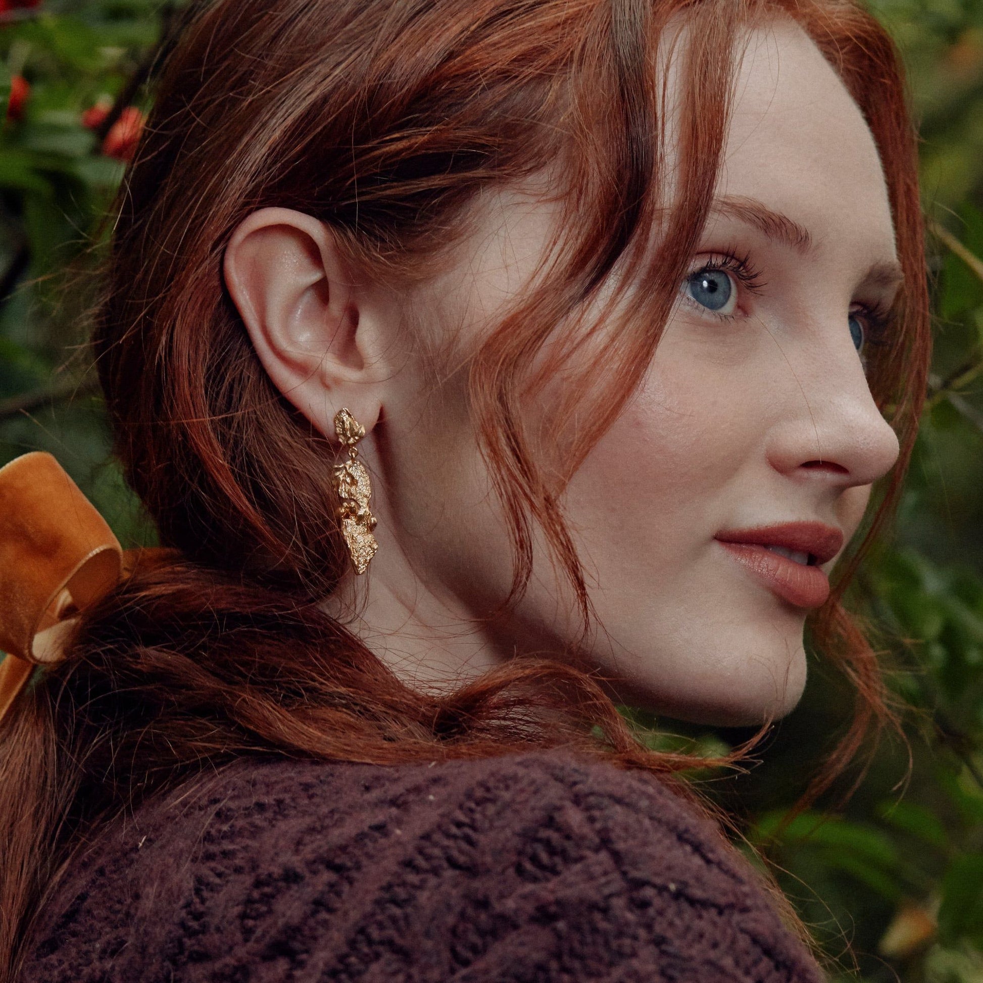 gold forest earrings worn