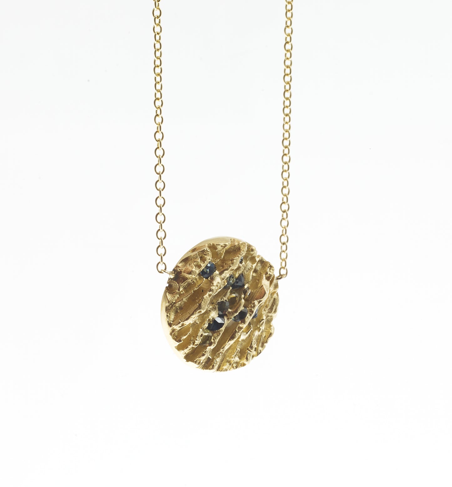 gold and blue pendant