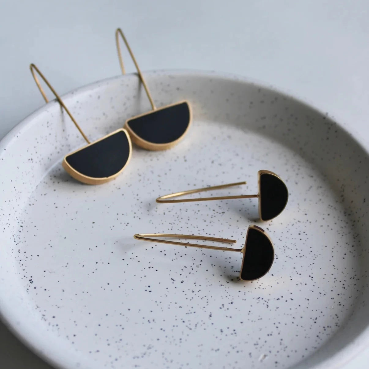 gold arc black drop earrings