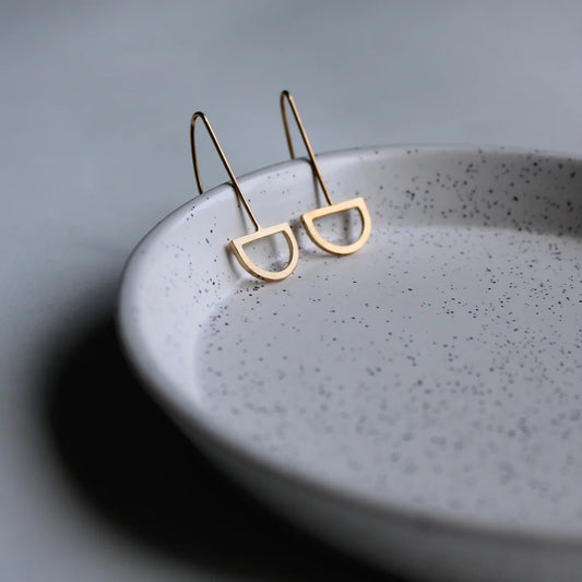 gold arc drop earrings