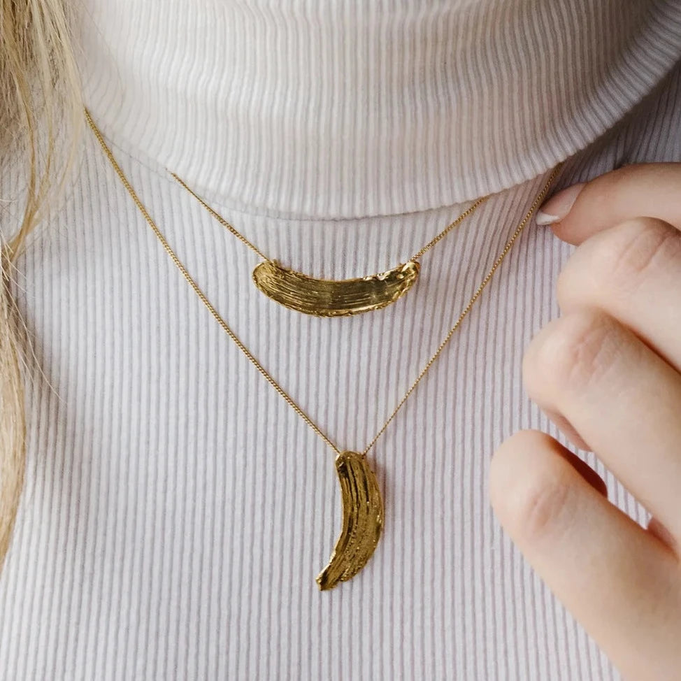 gold brushstroke necklaces worn