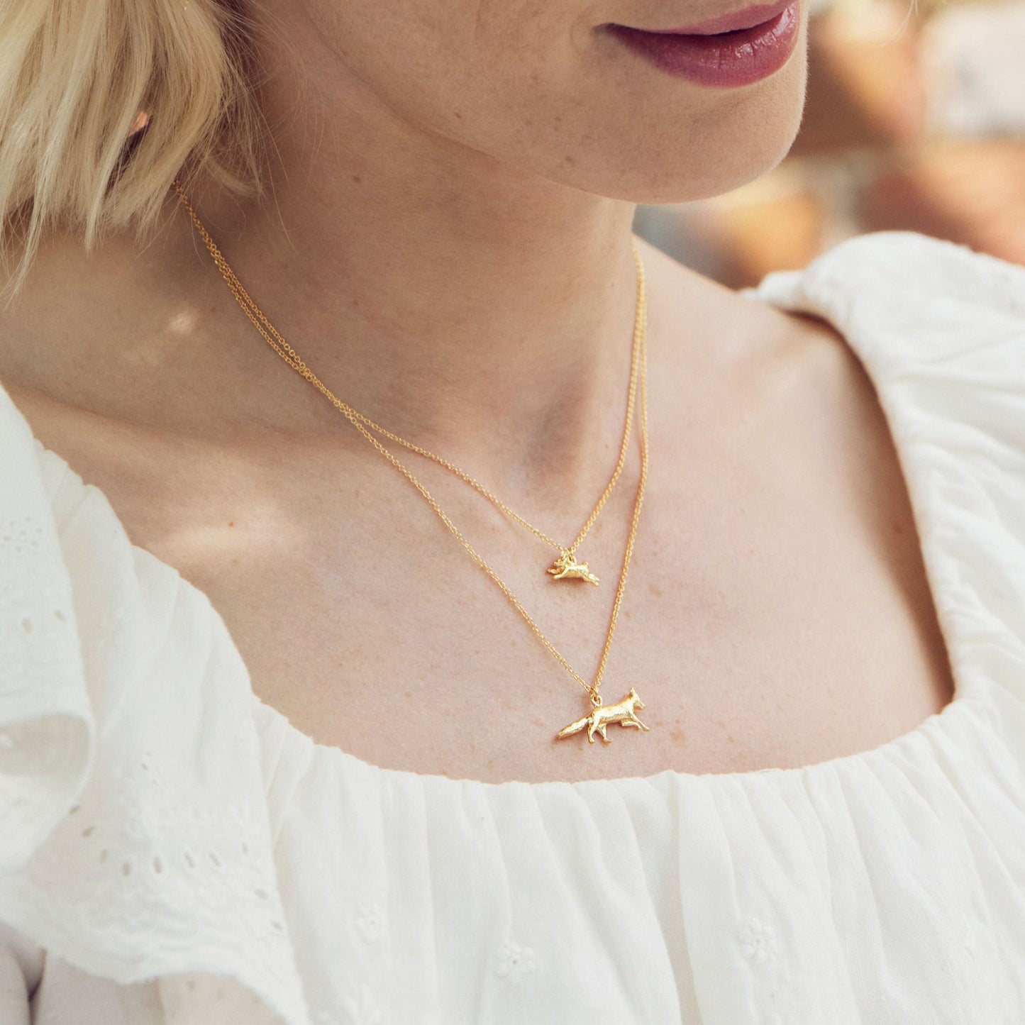 gold fox necklace worn