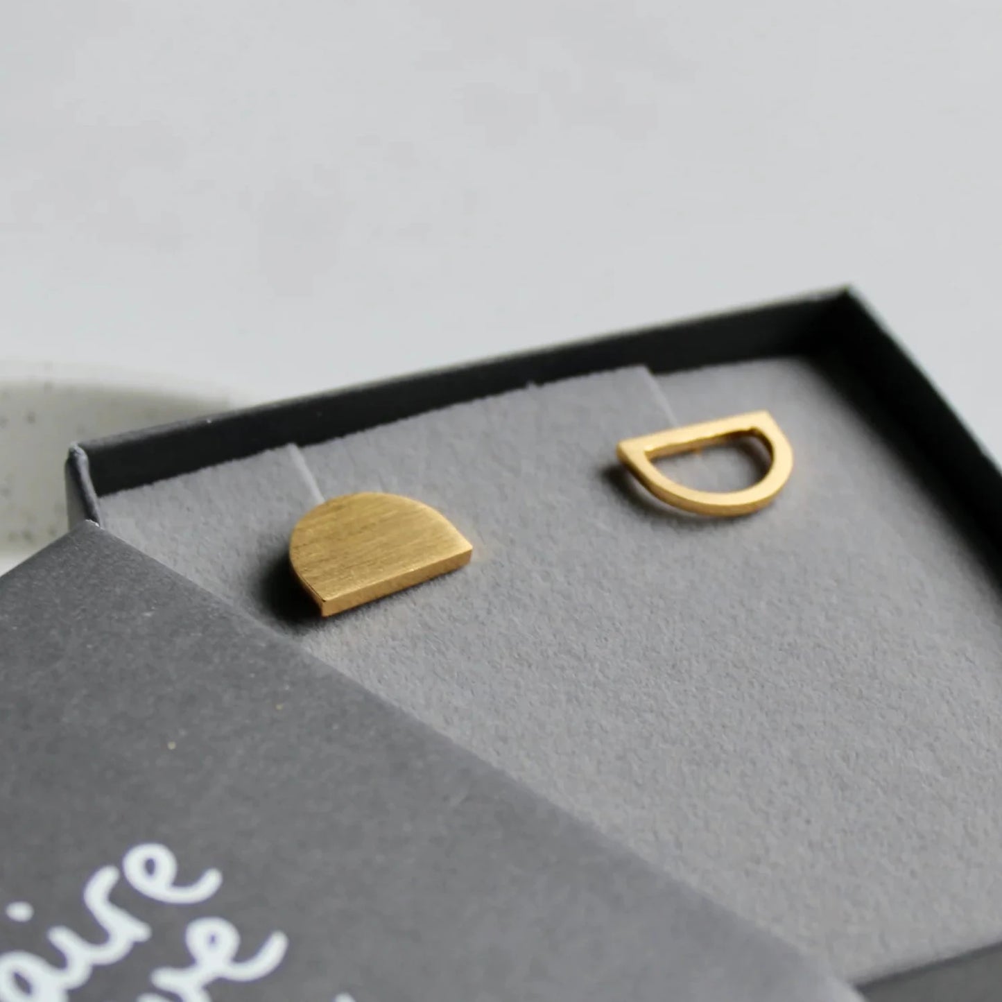 gold odd arc stud earrings