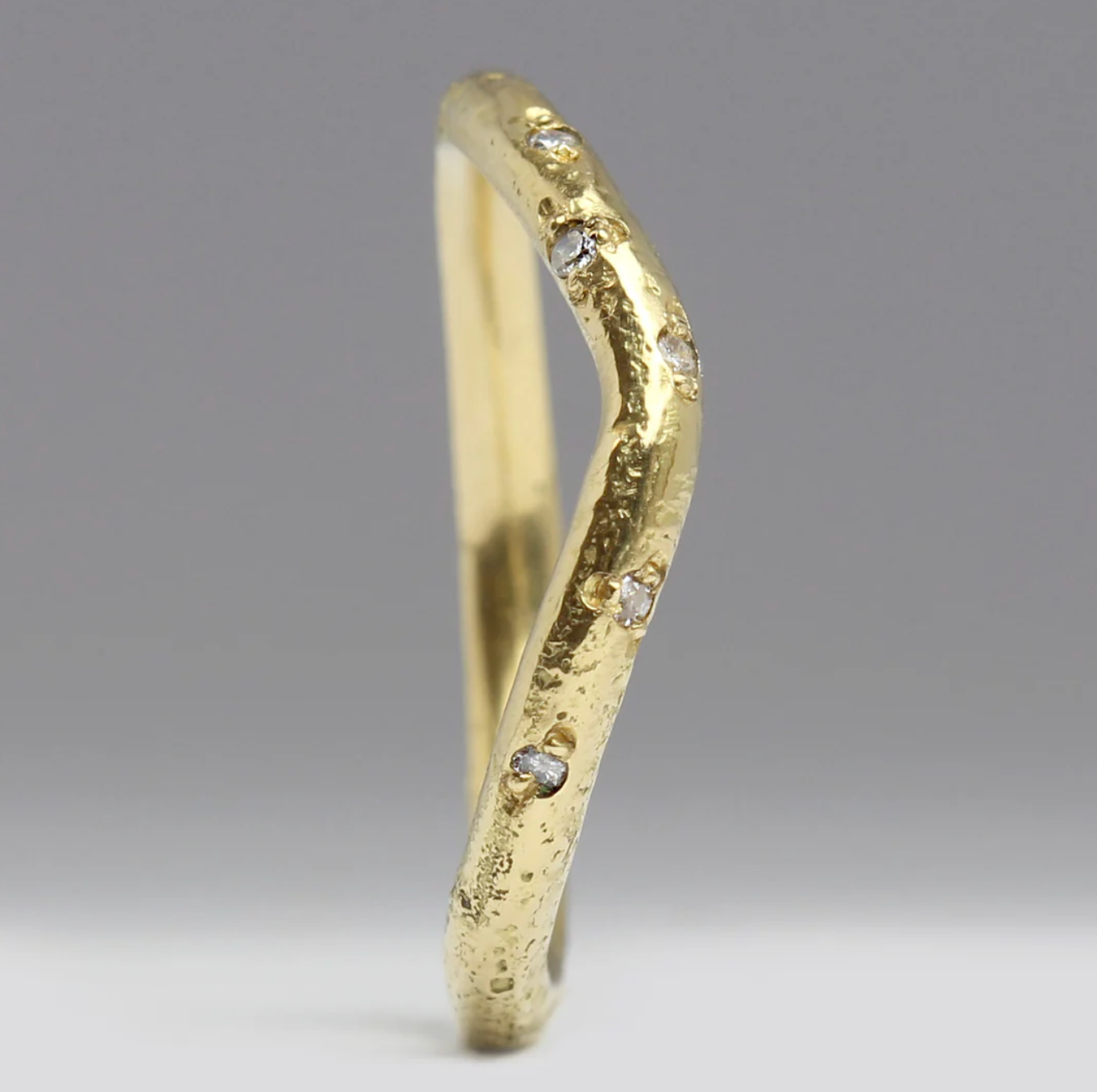 sandcast yellow gold and diamond wedding ring