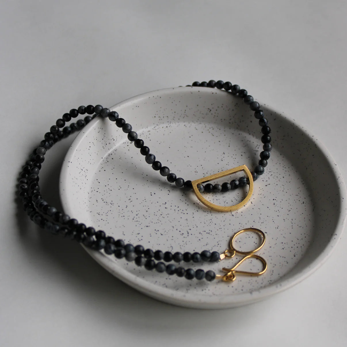 obsidian necklace with gold detail