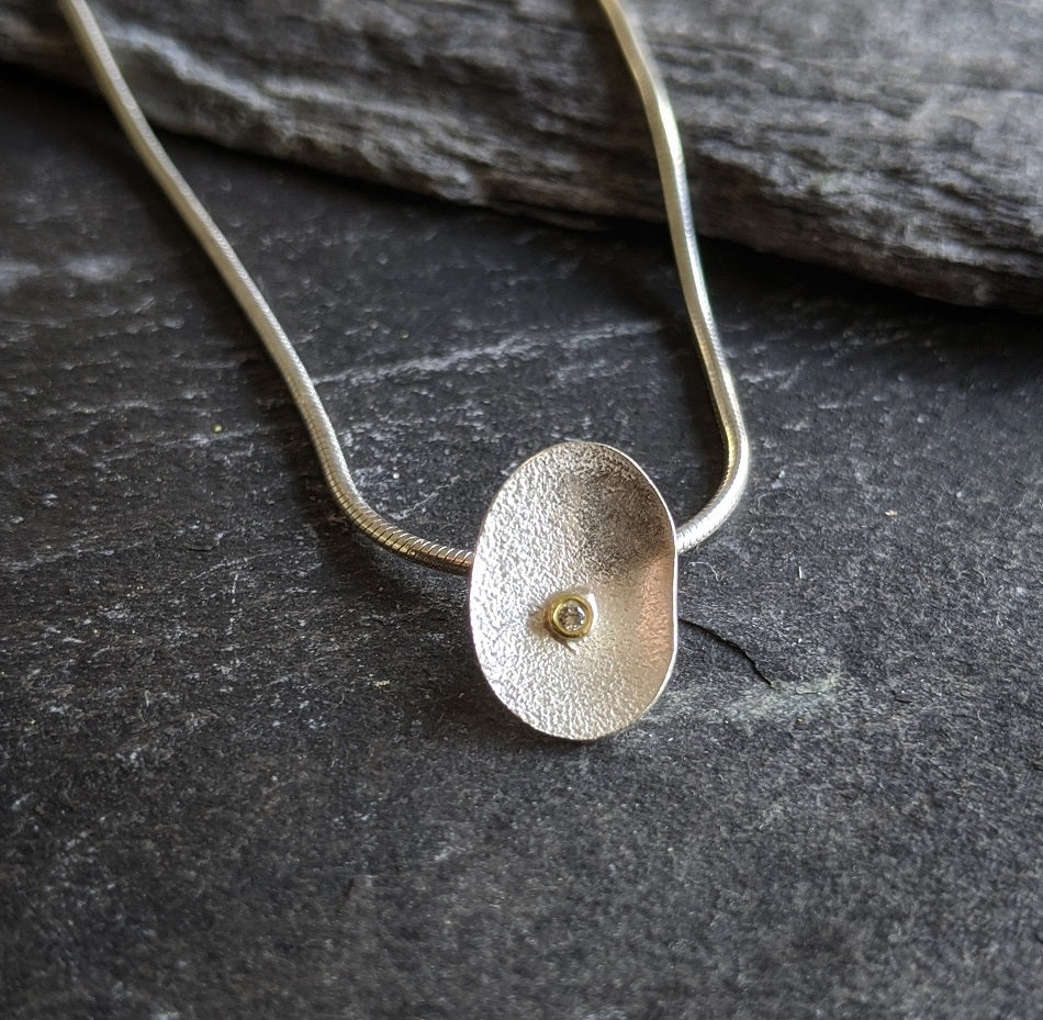silver petal and diamond pendant