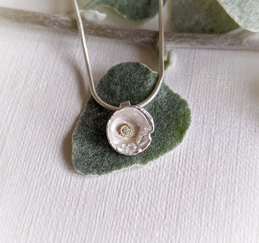 silver and diamond pendant