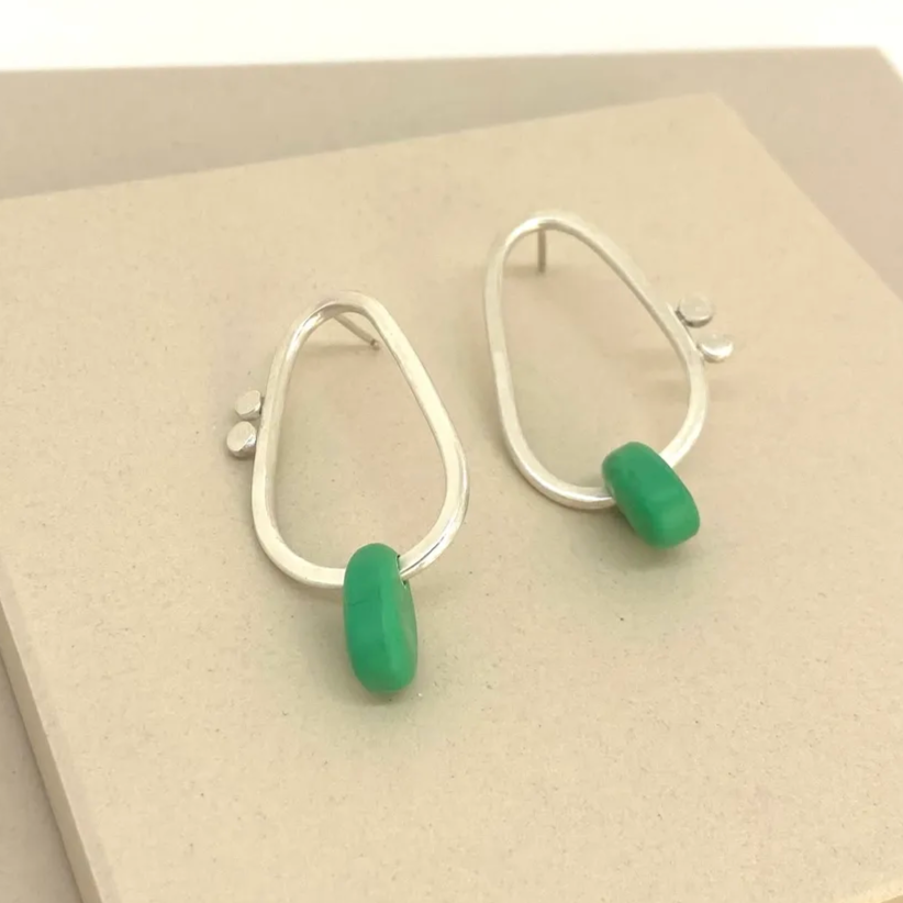 green plastic and silver flotsam earrings