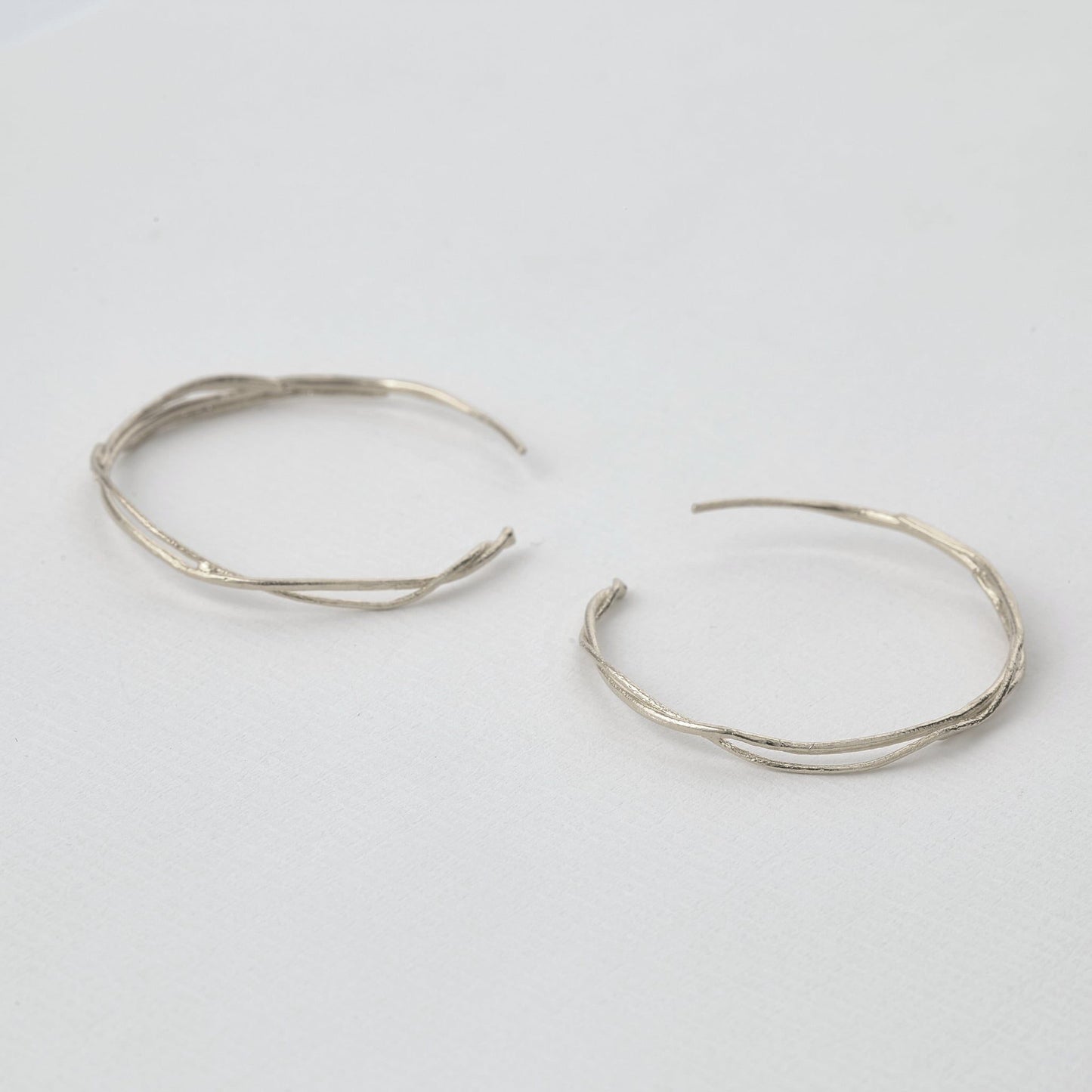 silver twist hoop earrings