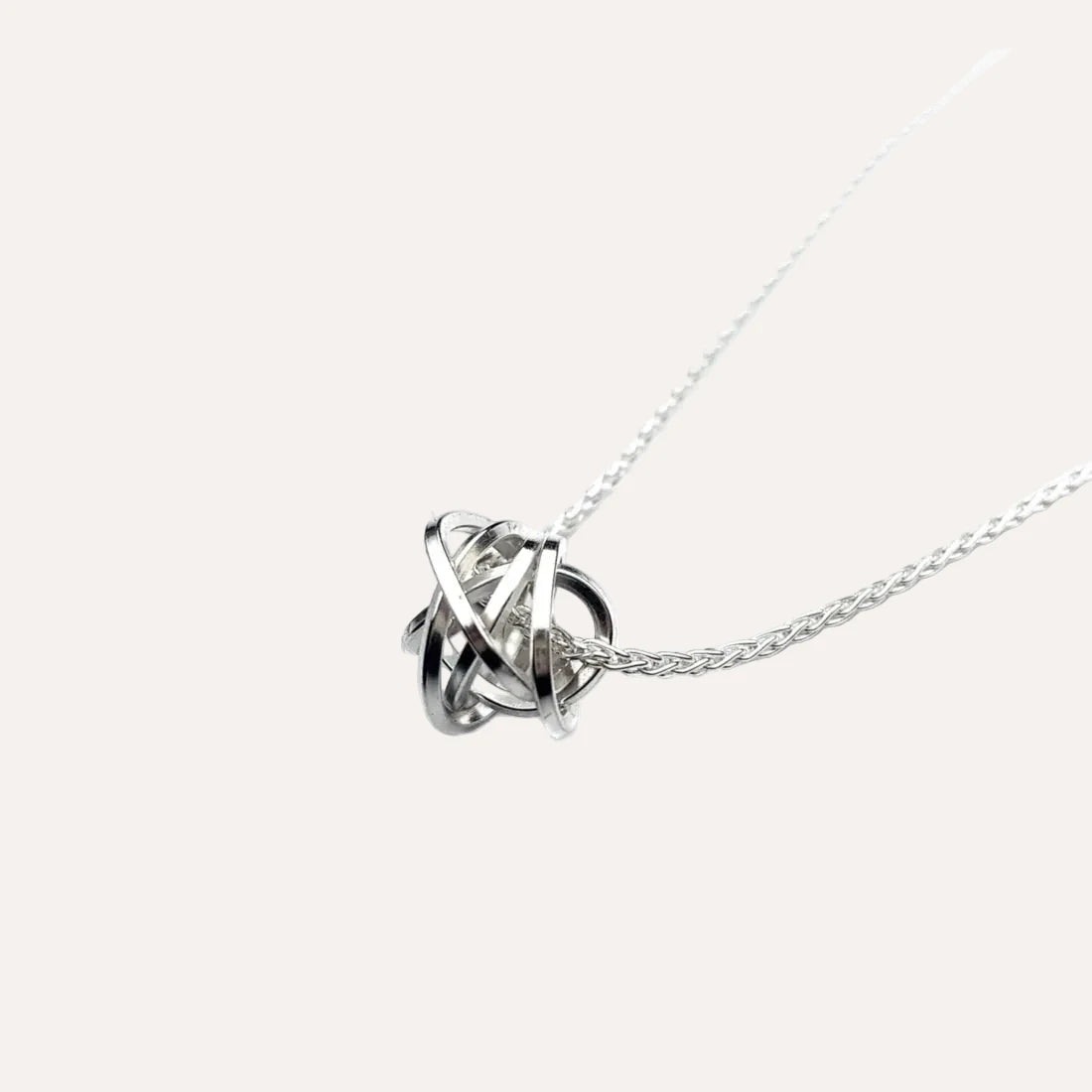silver knot pendant on a silver chain