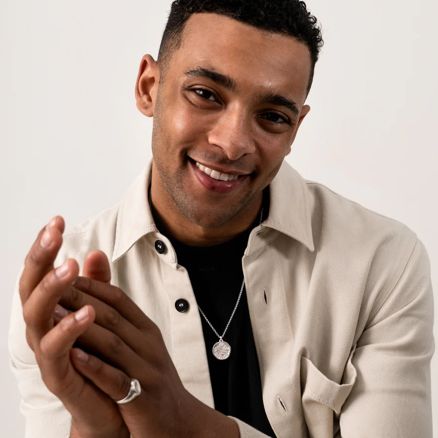 silver sixpence necklace worn