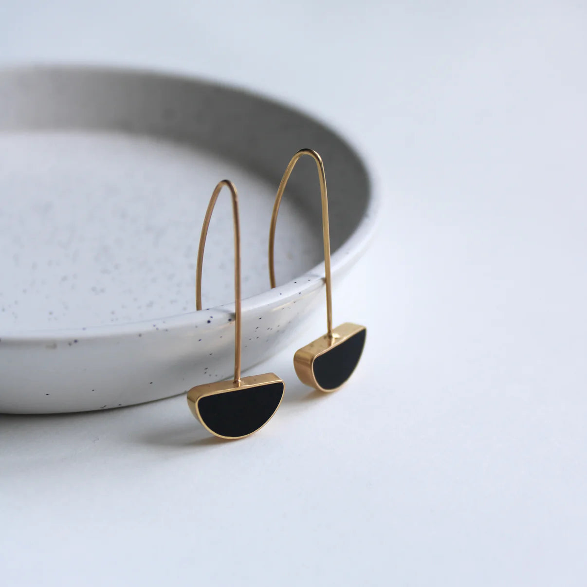 gold arc black drop earrings