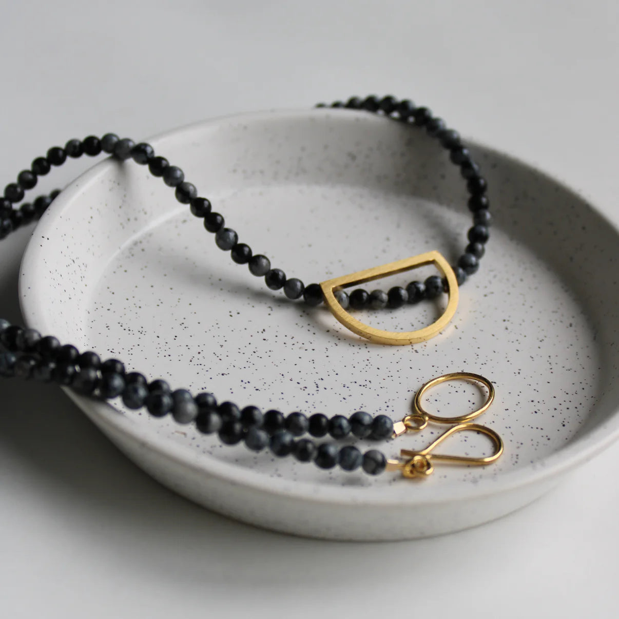 snowflake obsidian necklace with gold details