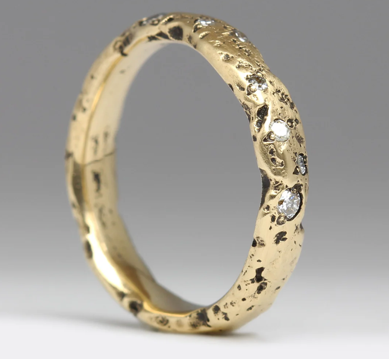 textured gold ring with diamonds