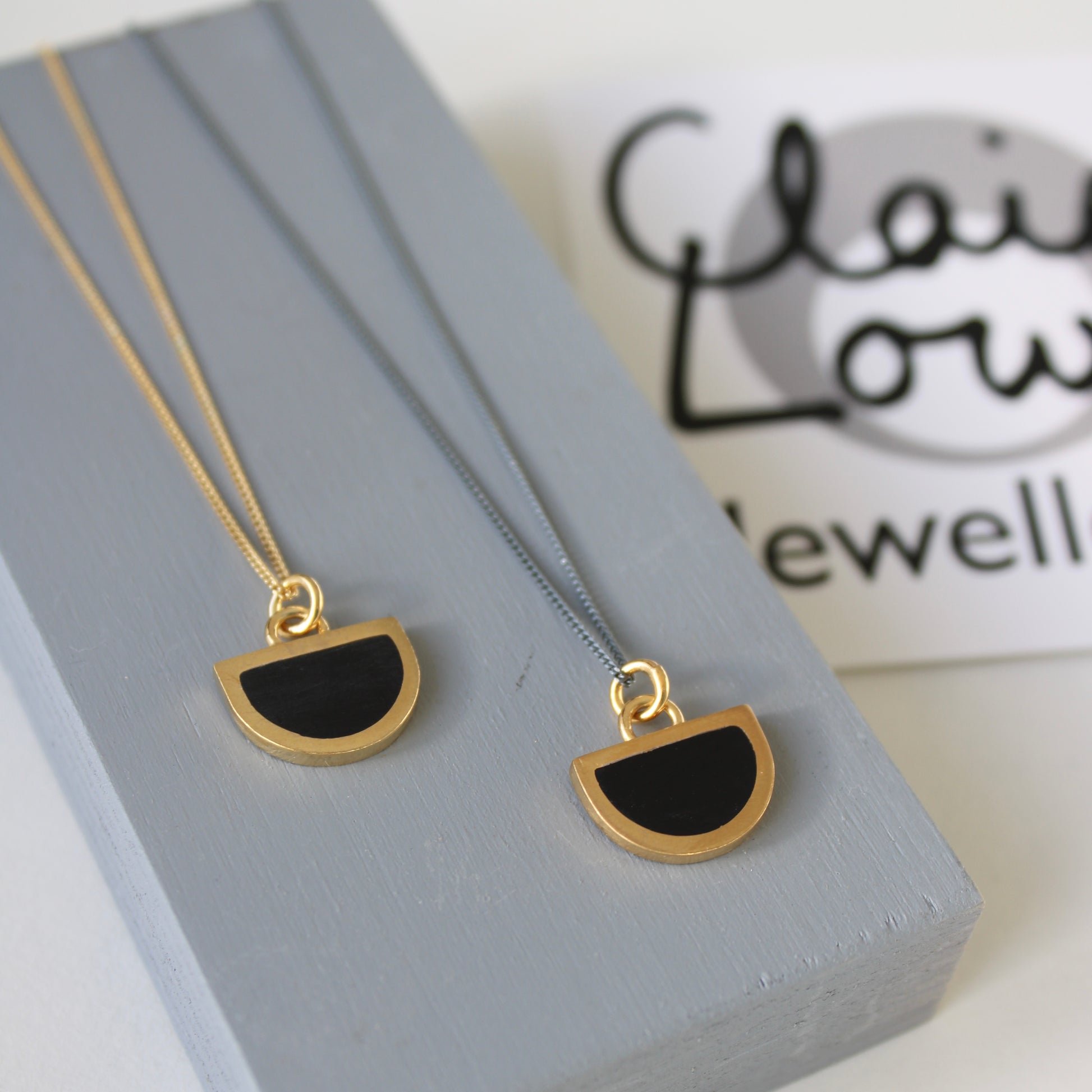 black resin and gold arc pendant