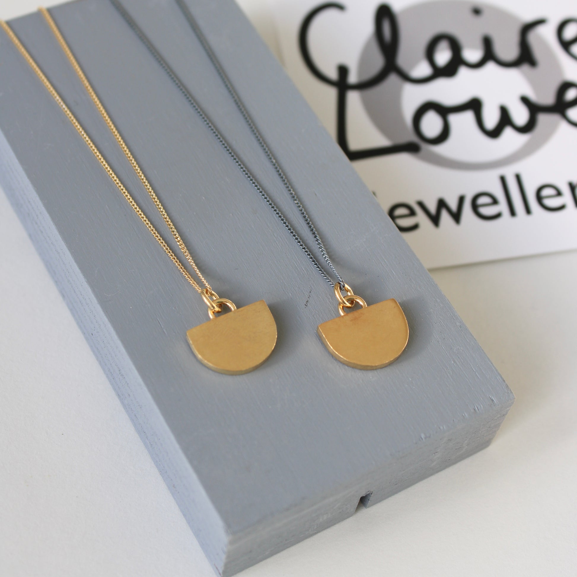 tiny gold arc pendants