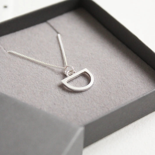 tiny silver arc pendant