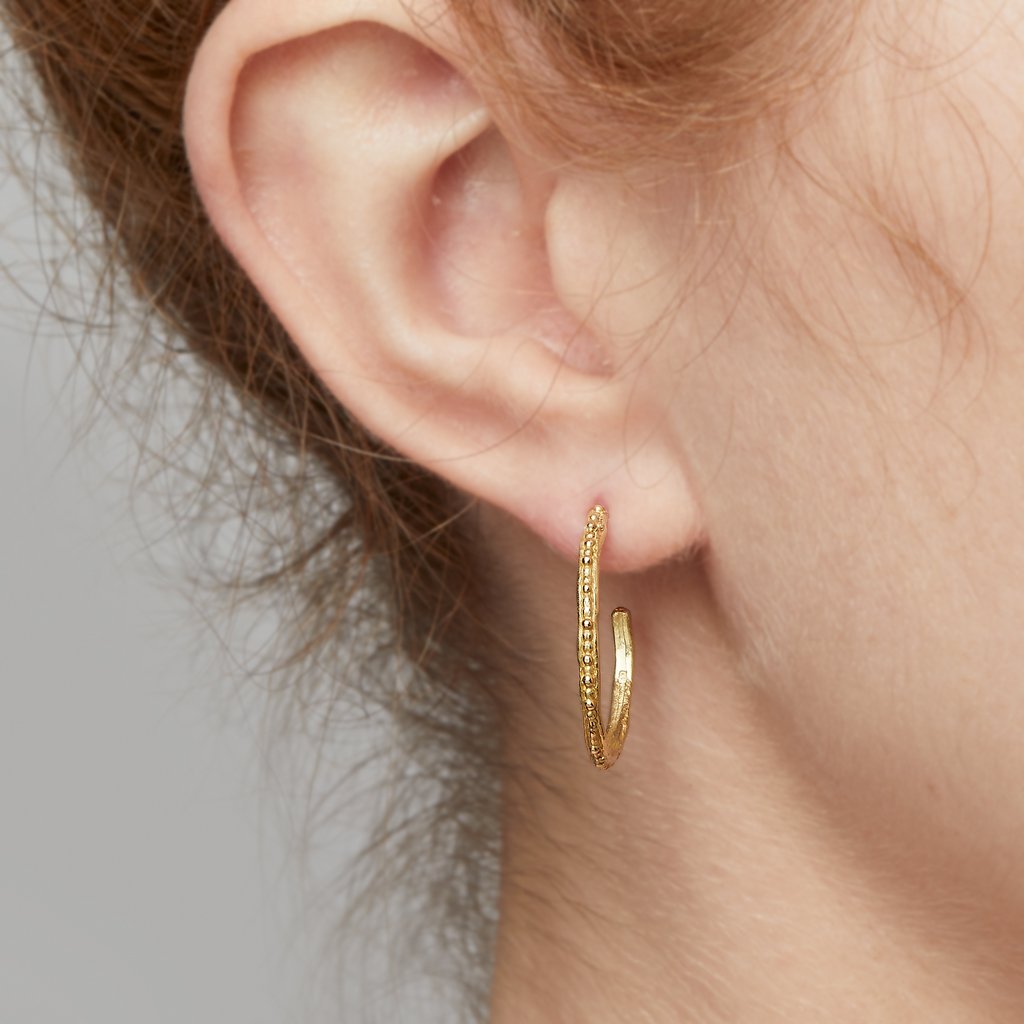 beaded gold hoop earrings worn