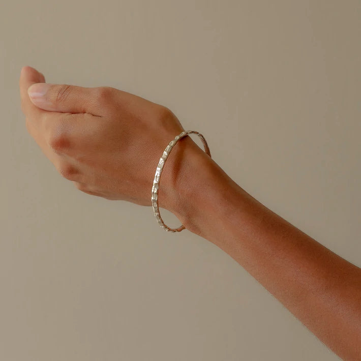 silver cockle bangle worn