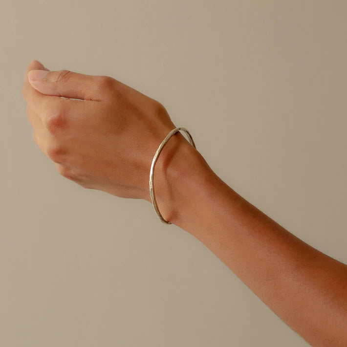 silver rock bangle worn