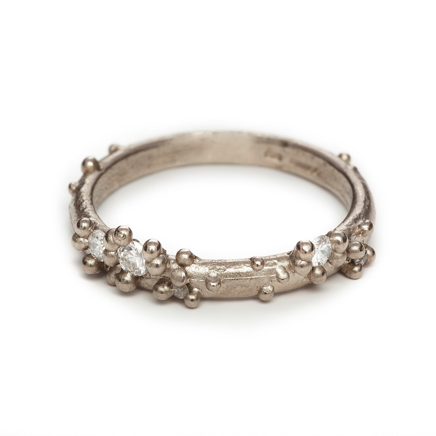 white gold and diamond wedding ring with granulation