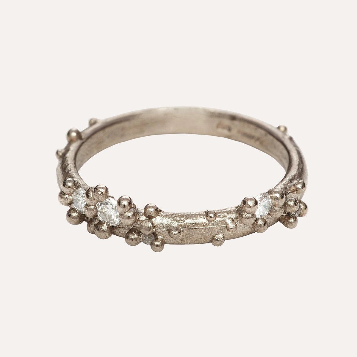 white gold and diamond wedding ring with granulation