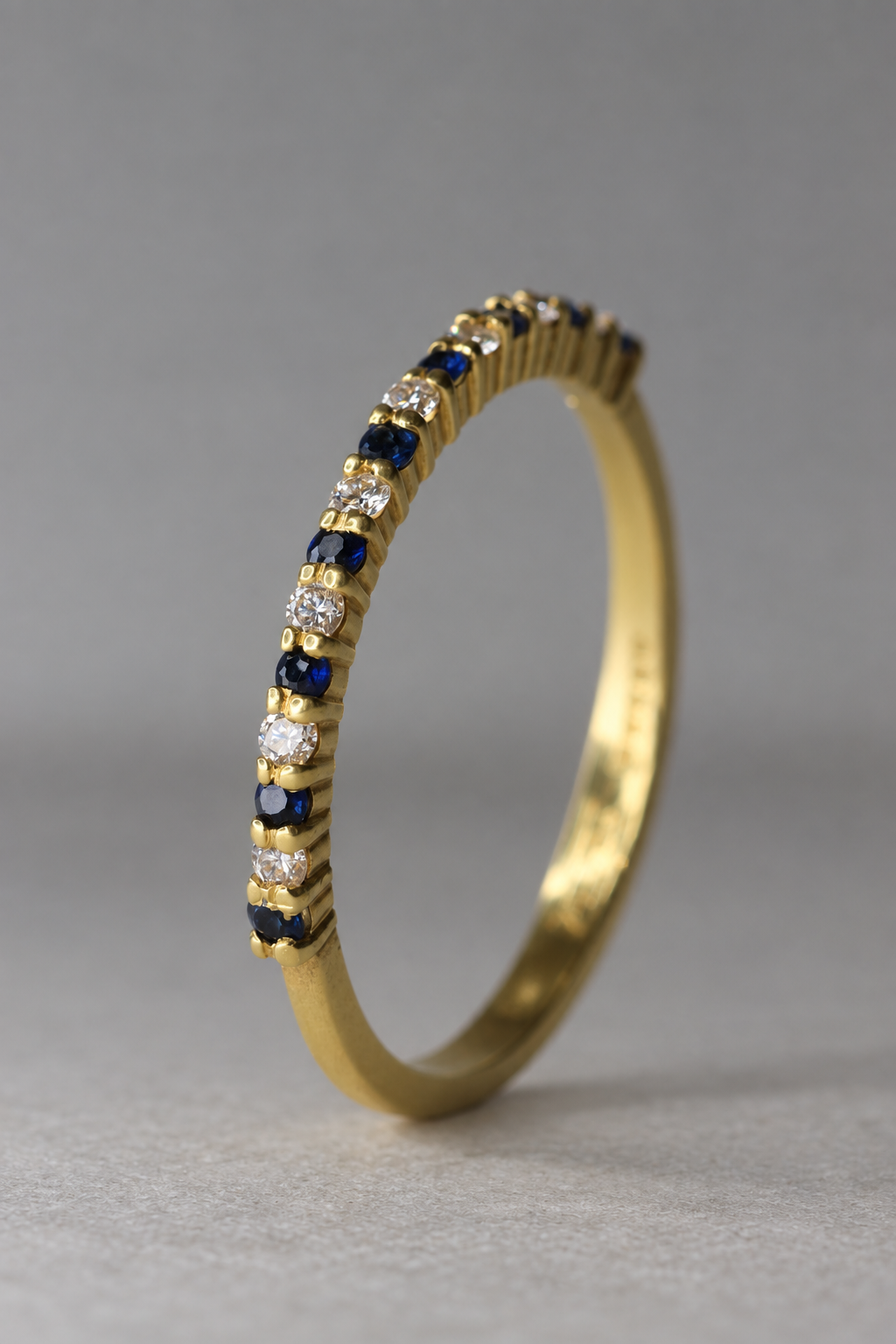 Blue Sapphire and Diamond half eternity ring