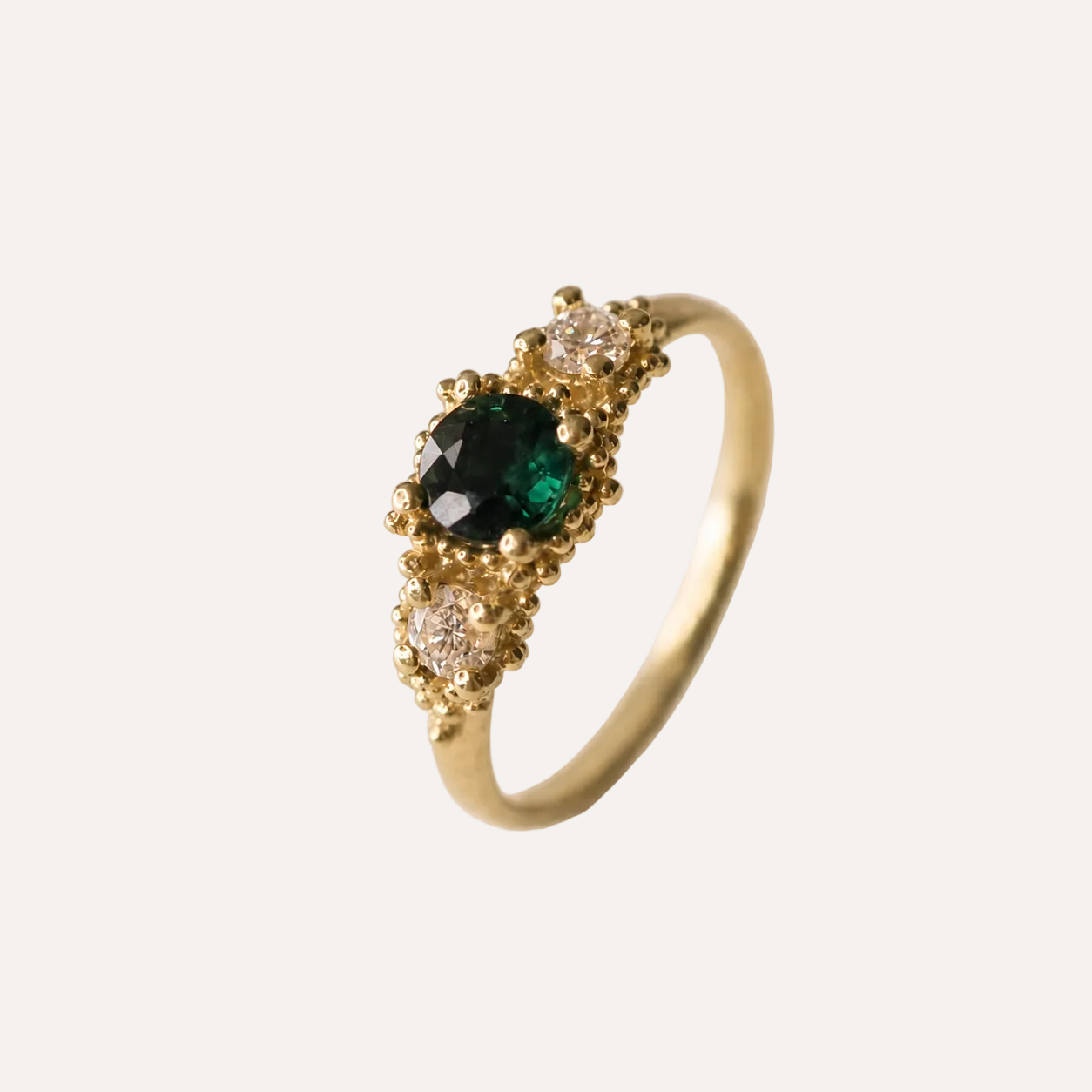 Triple cluster ring with teal sapphire