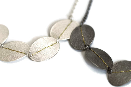 Sewn up 5 disk necklaces - gold thread