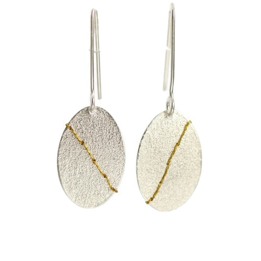Sewn up earrings large - gold thread