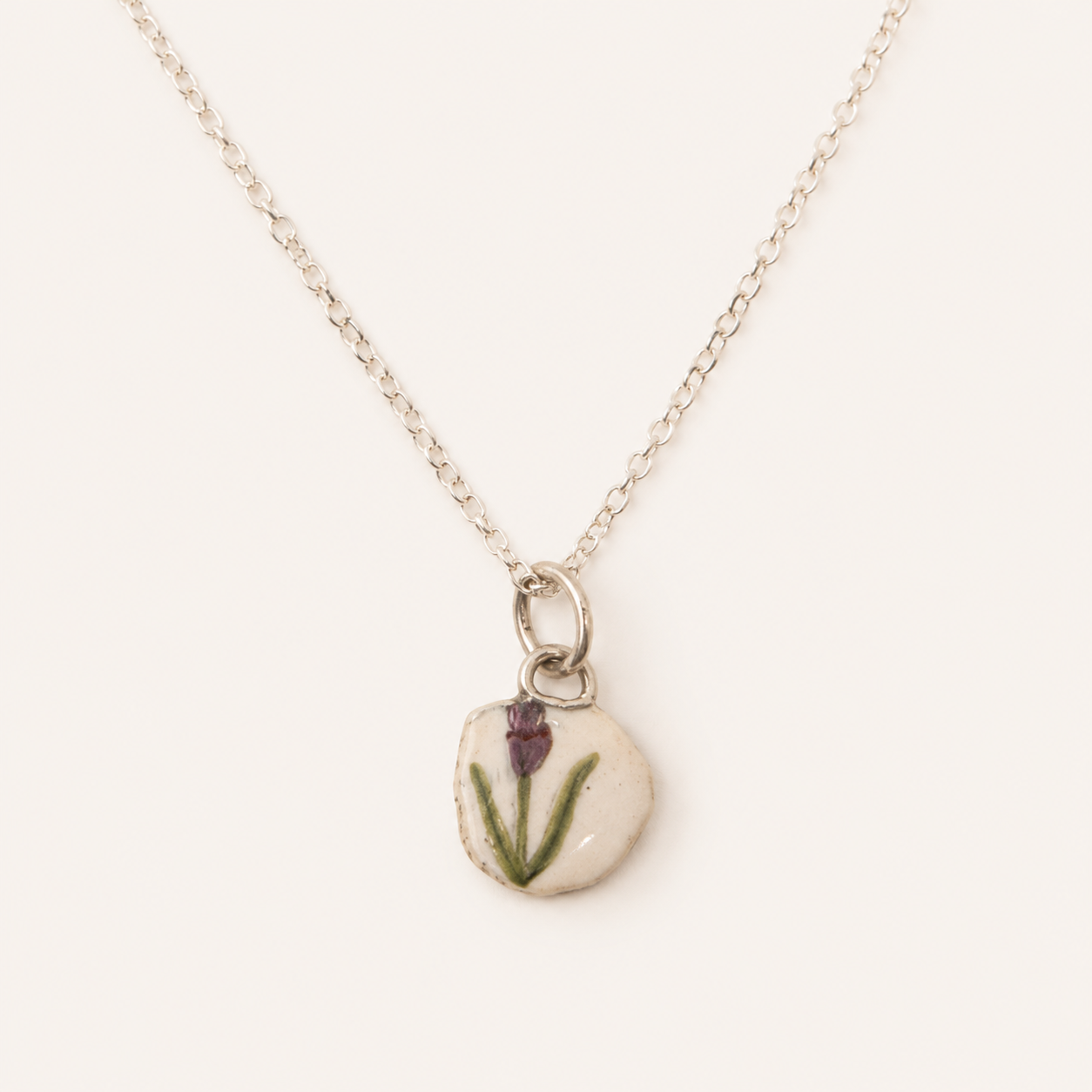 Tulip on white enamel pendant
