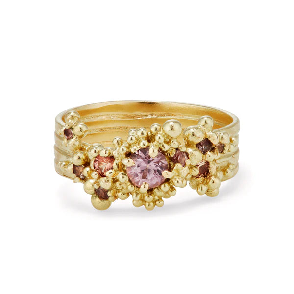 yellow gold whorl ring with pink stones