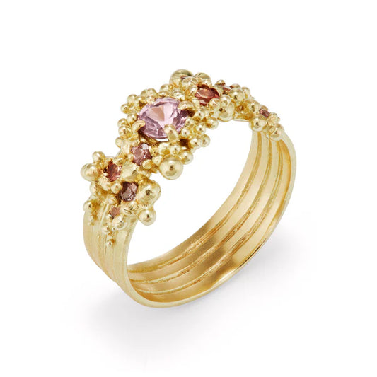 gold whorl ring with pink sapphires