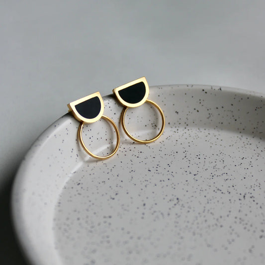 arc black and gold studs