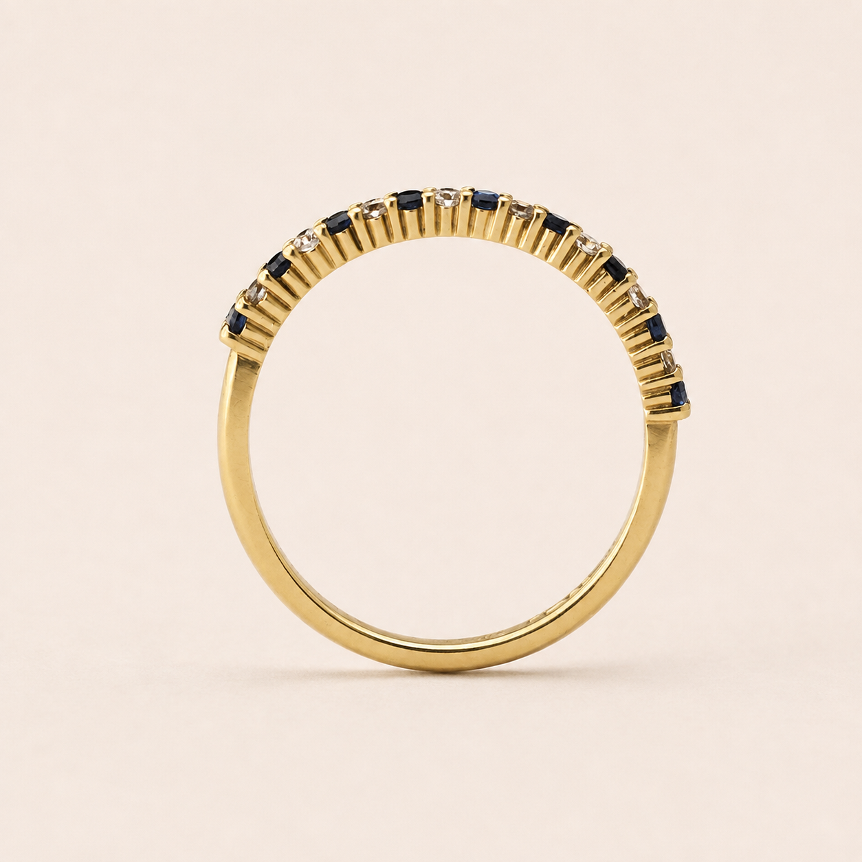 Blue Sapphire and Diamond half eternity ring