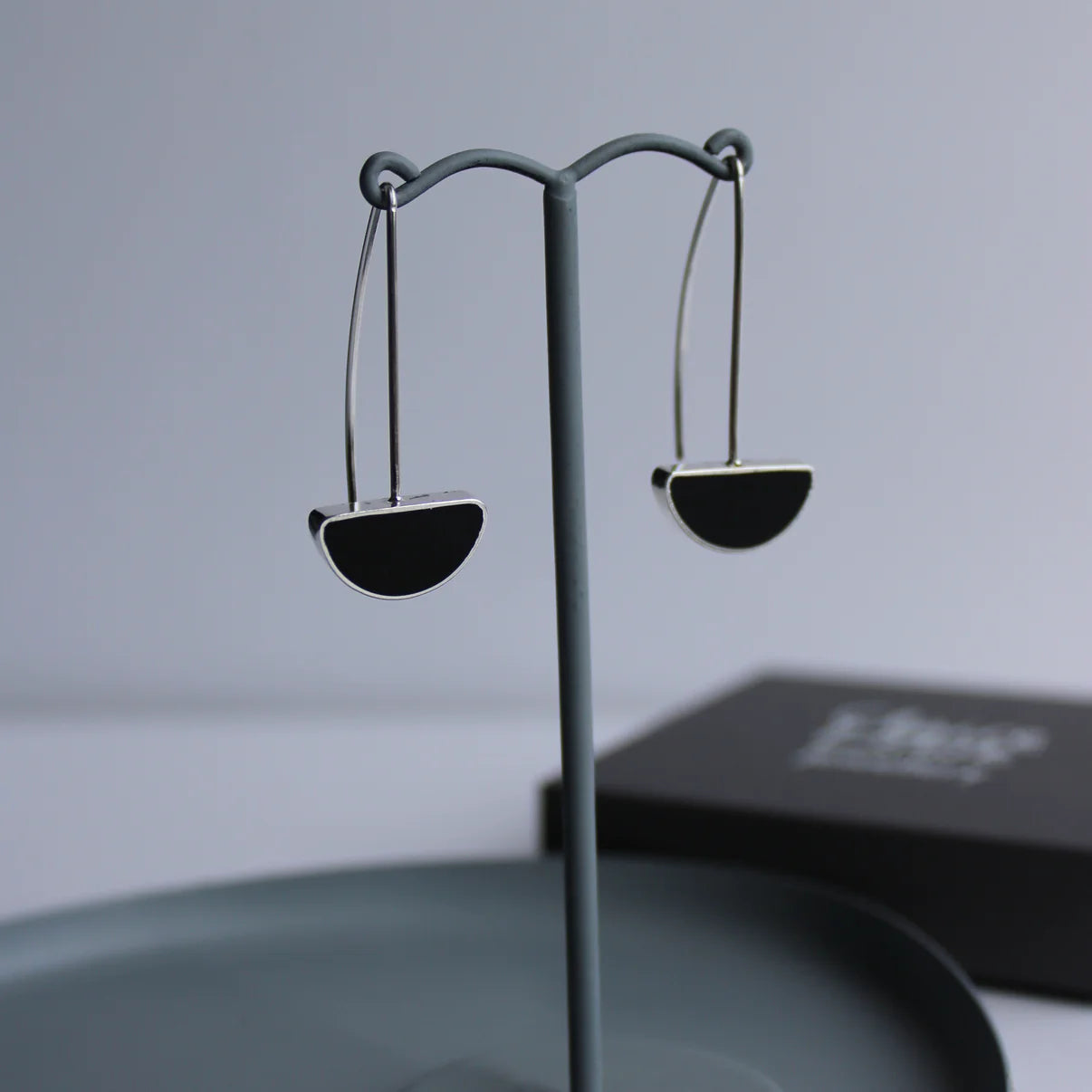 black arc drop earrings