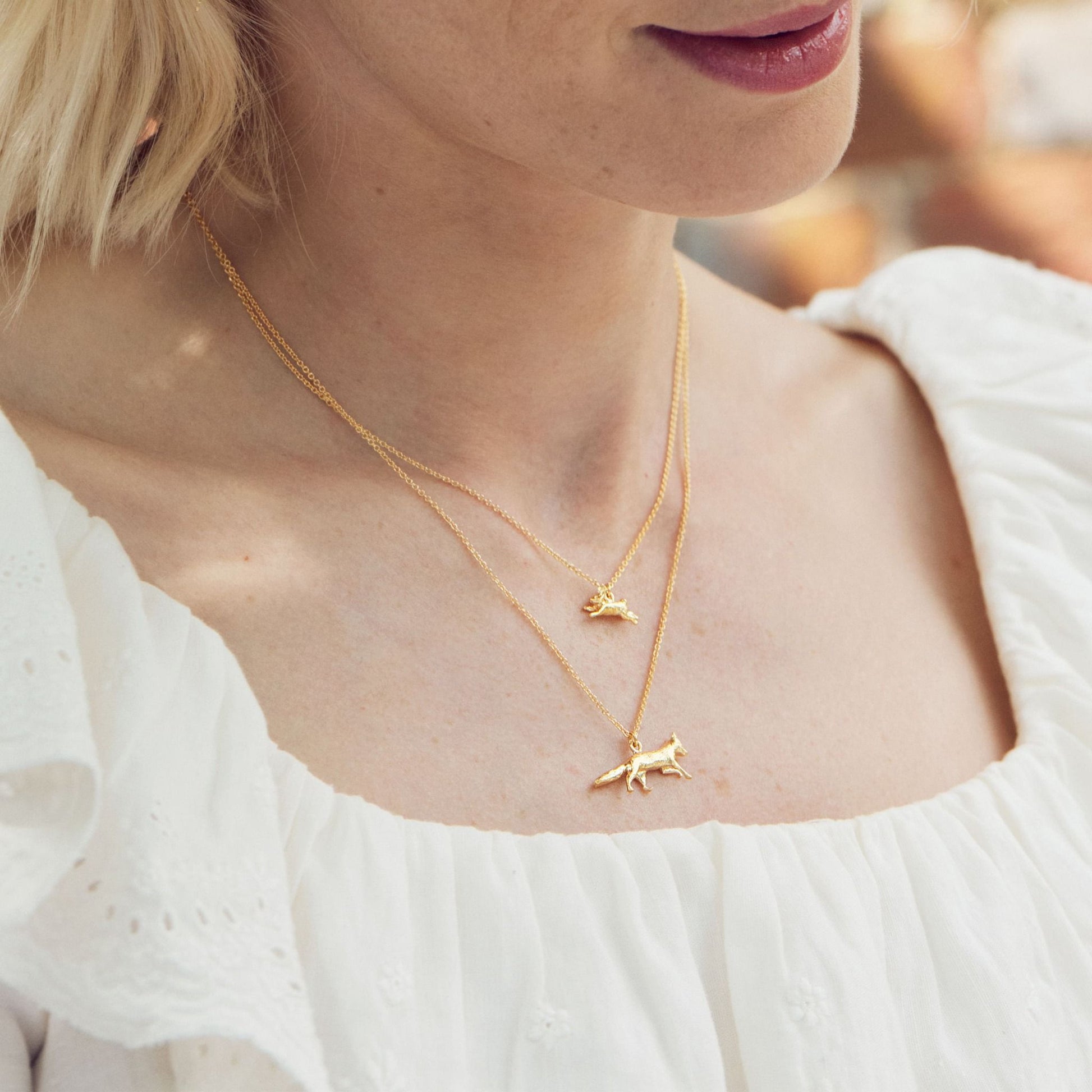 gold fox necklace worn