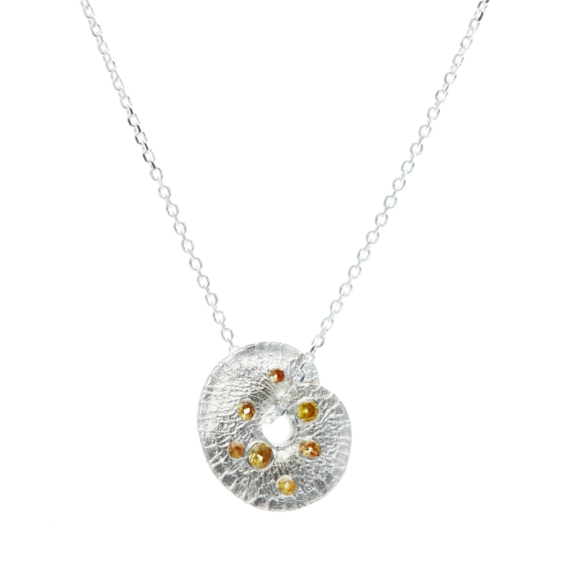 yellow and silver pendant