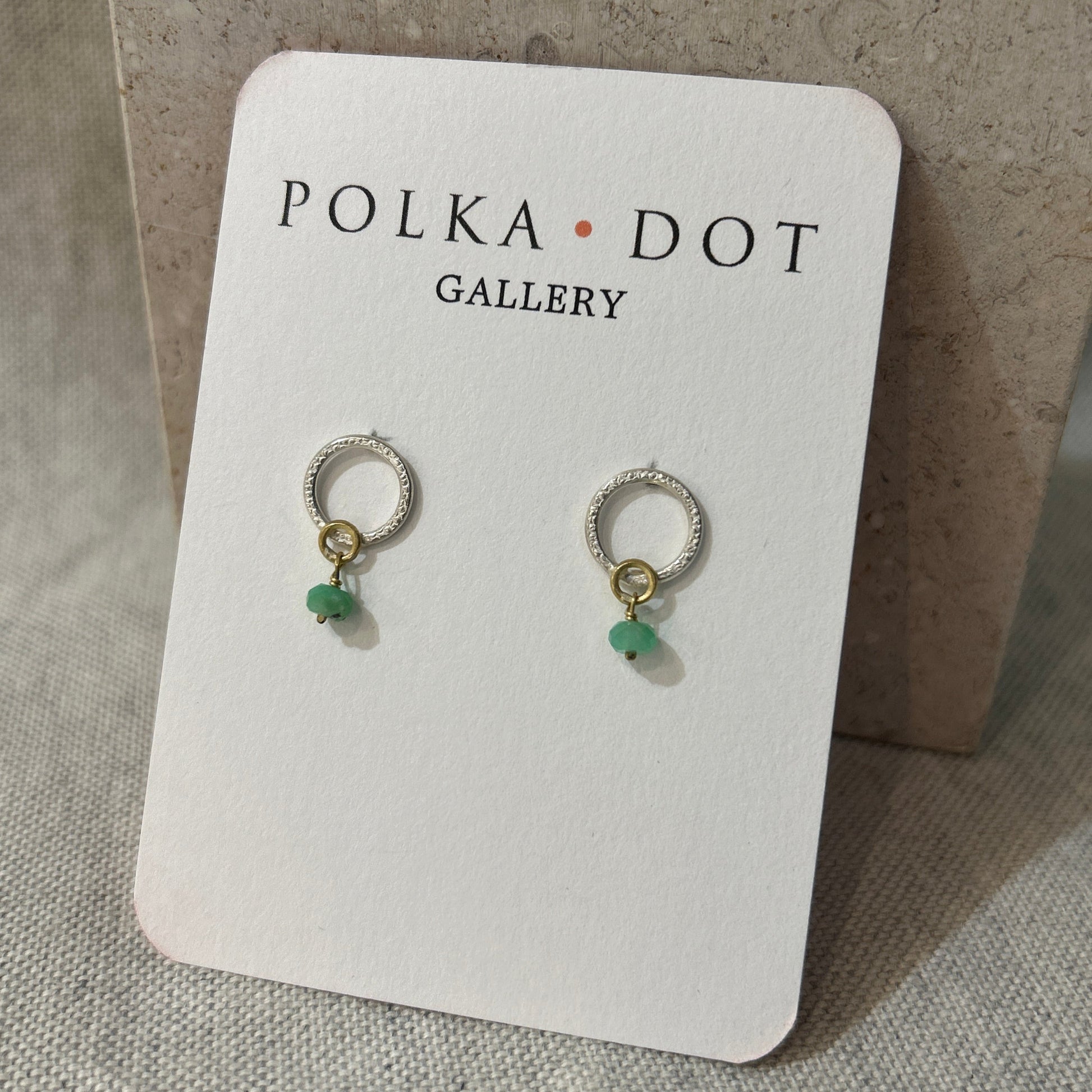 silver and green stud earrings