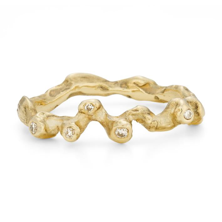 scattered diamond and gold wedding ring