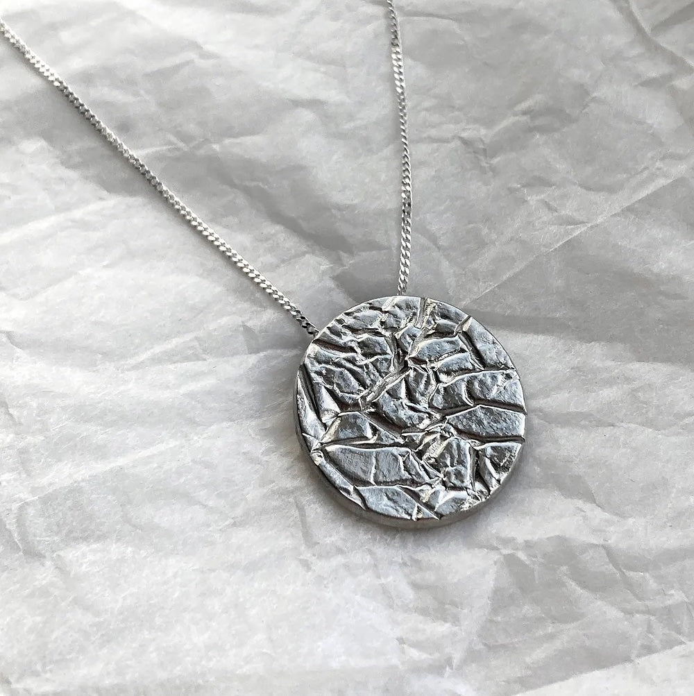 silver creased pendant