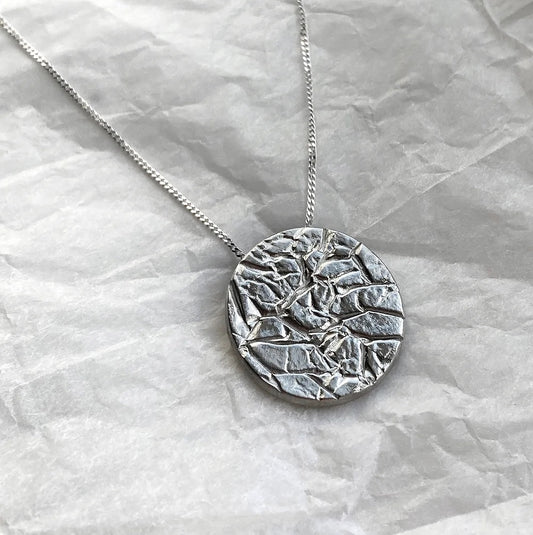 silver creased pendant